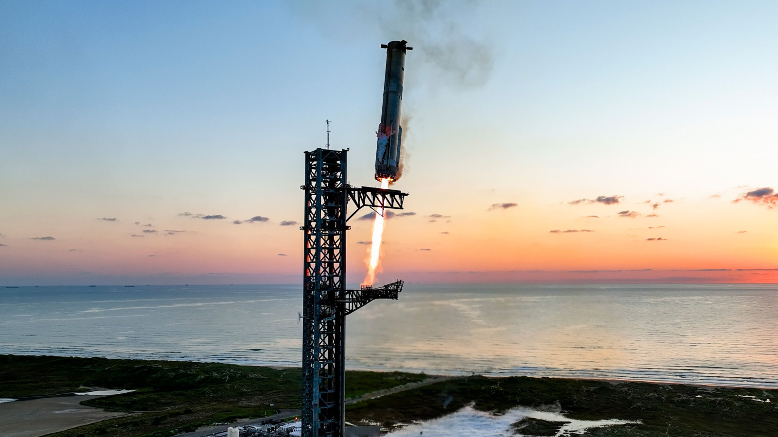 Rocket launching against a warm sunset sky 